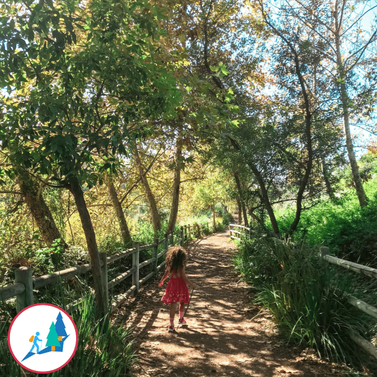 Child walking on a kid friendly trail.