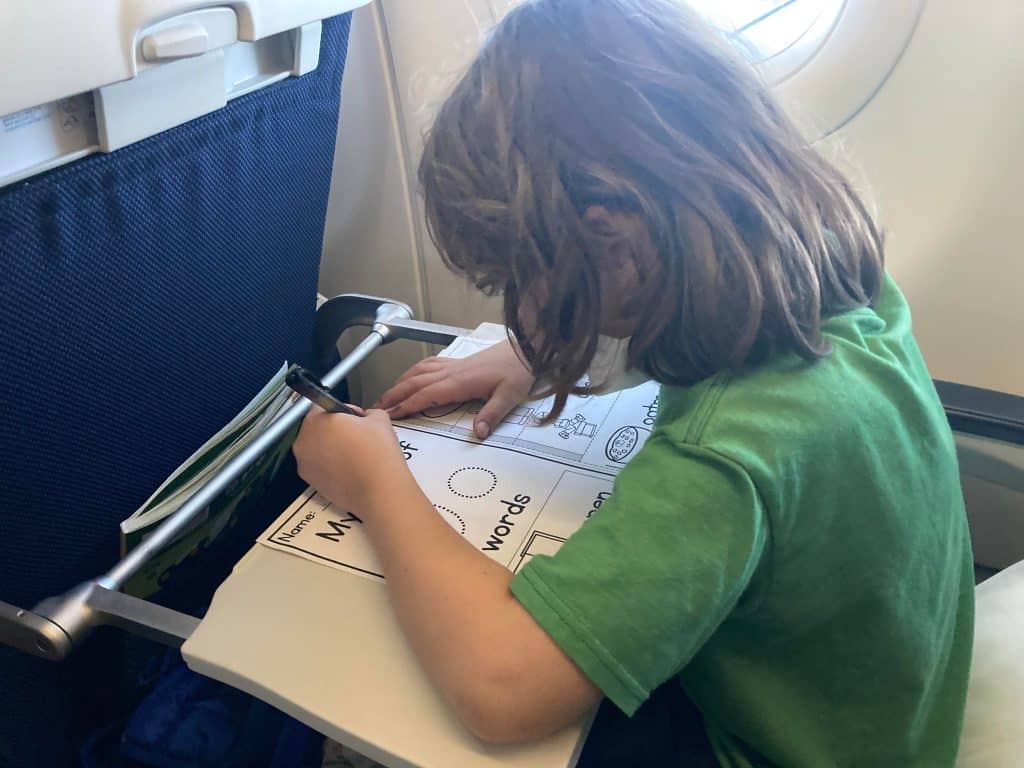 Child busy in an airplane.