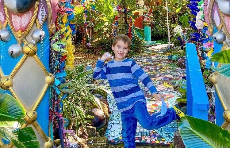 Child in front of the Whimzeyland art exhibit in south florida