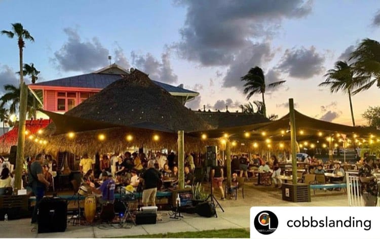 View of the outdoor dining of Cobbs Landing with live music in South Florida