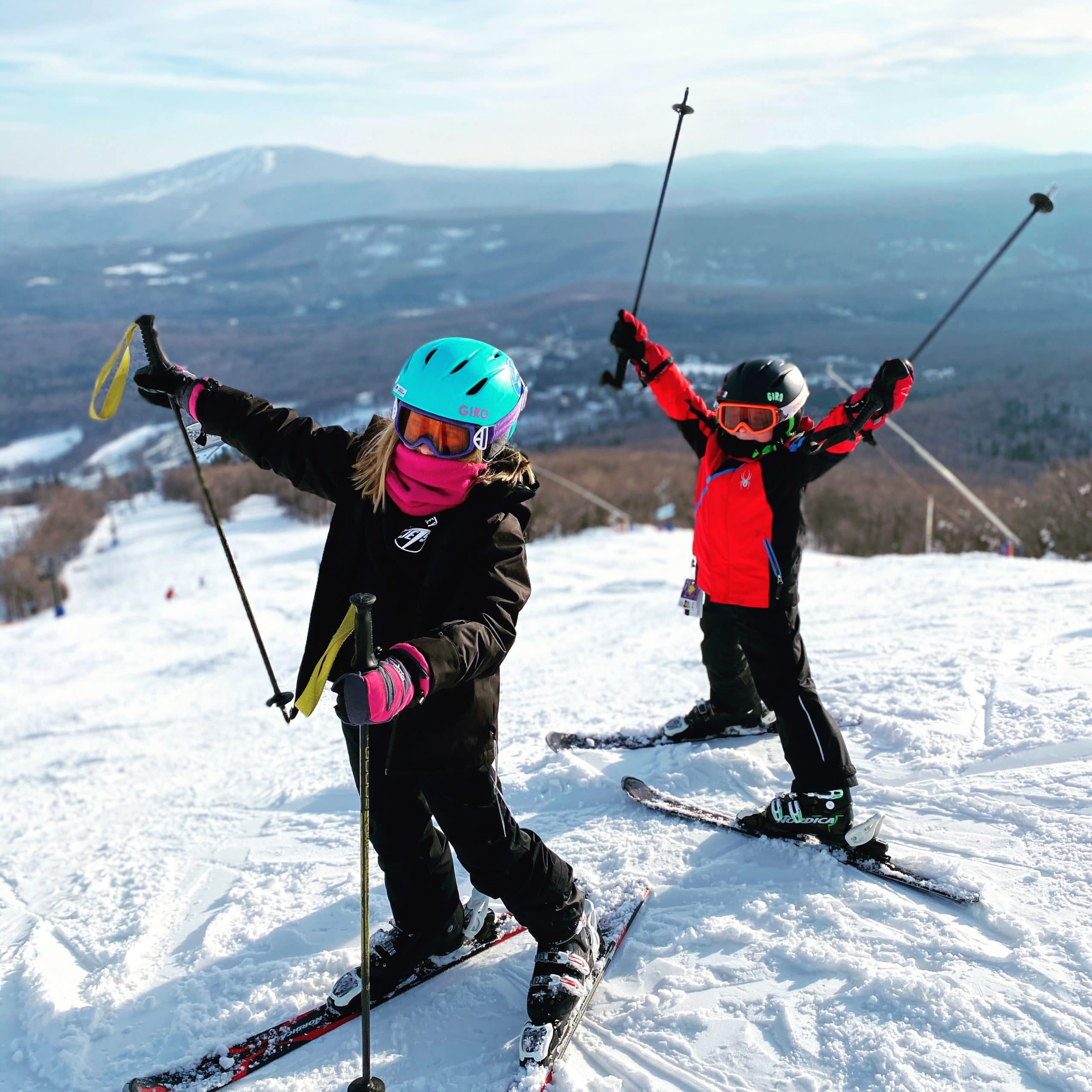 Kids happy with their ski at the top of the mountain at Bromley ski resort