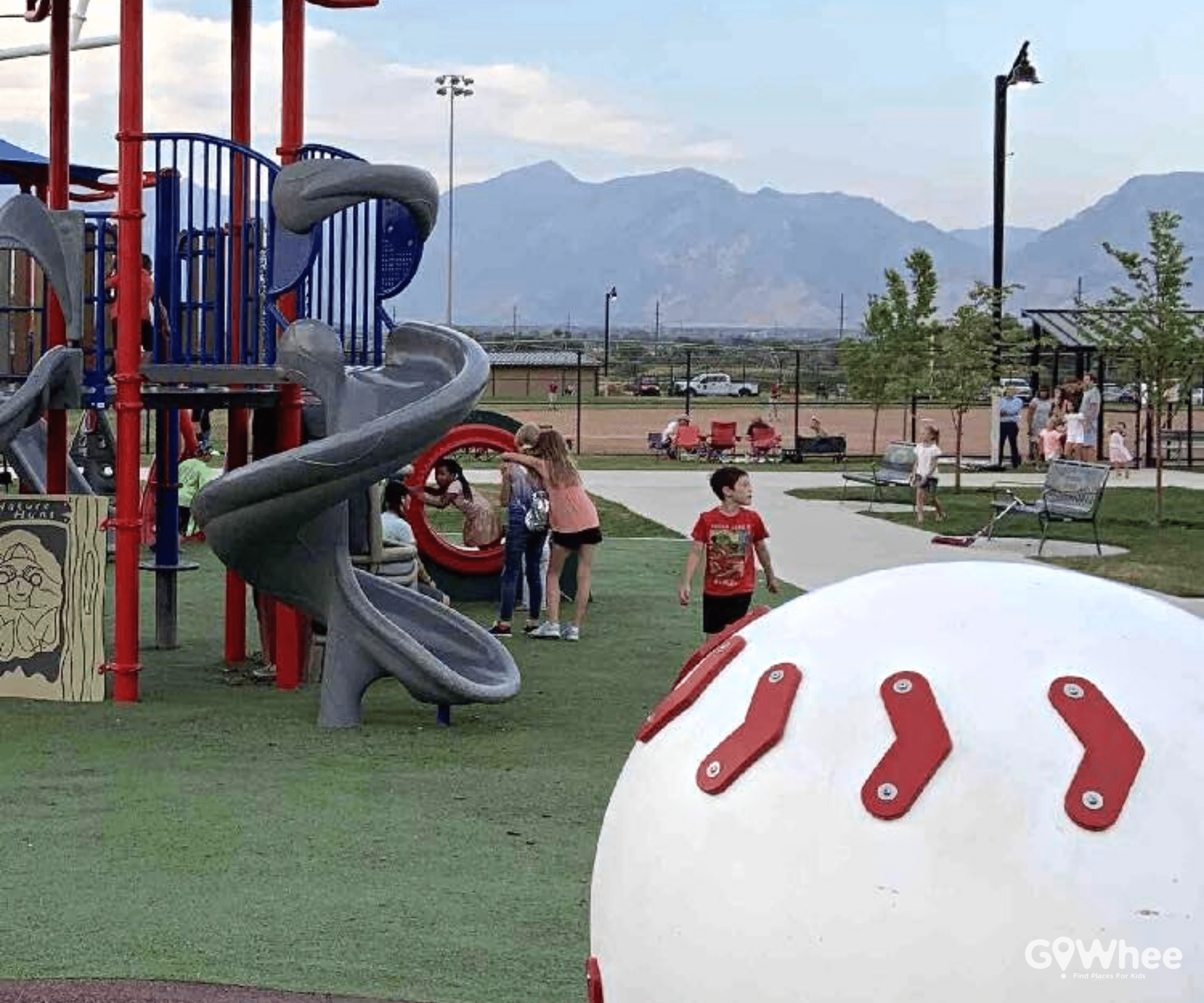 Little boy enjoying a baseball themed playground in Utah