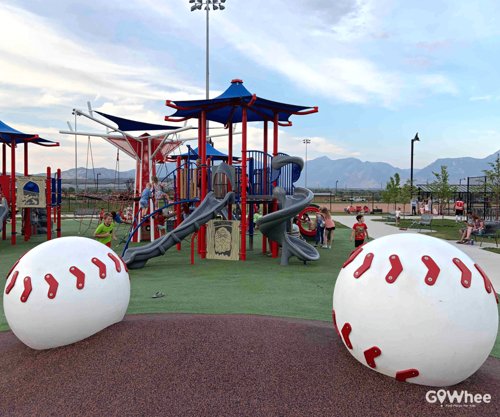Boy enjoying a baseball themed playground.