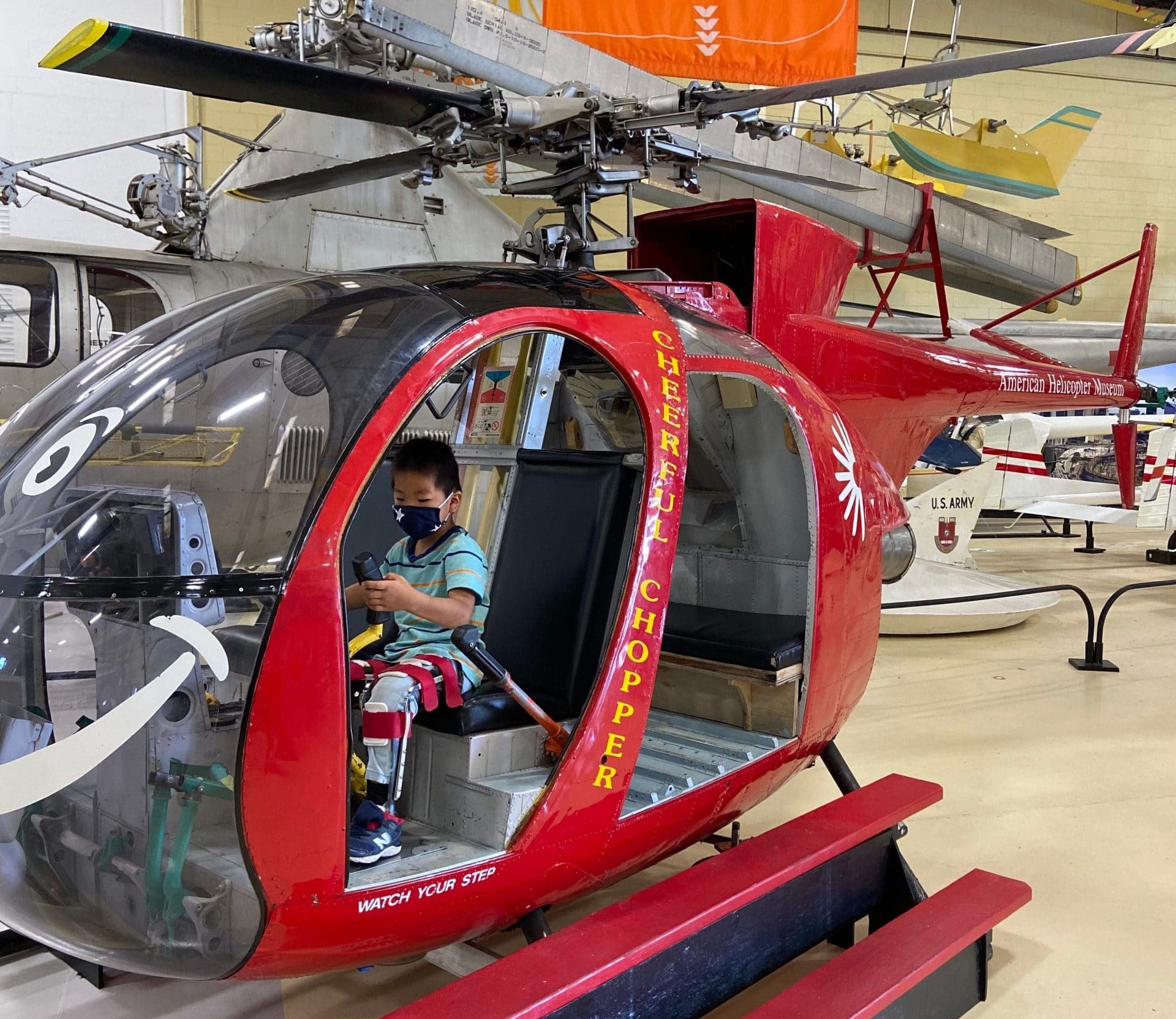 Kid in an helicopter at the American Helicopter museum