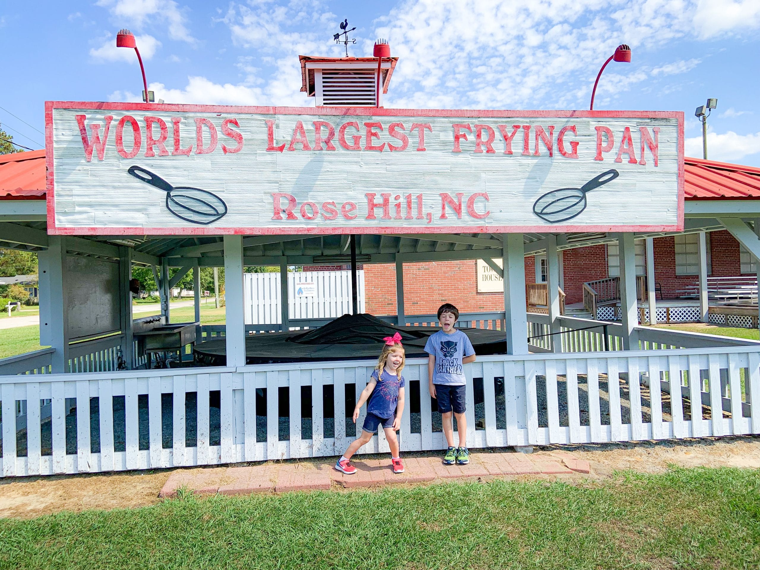 Kids in front of the world's largest frying pan Things to do in North Carolina with kids blog cover