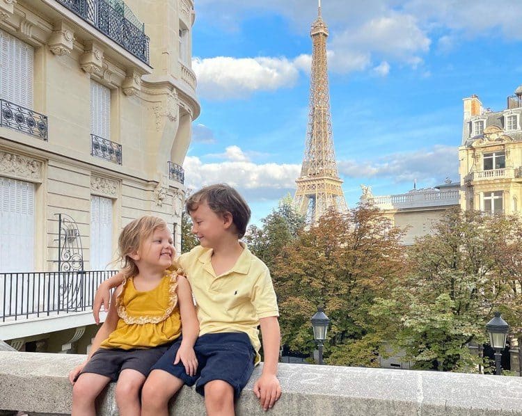 Family trip to Paris cover, kids with Eiffel tower in the background