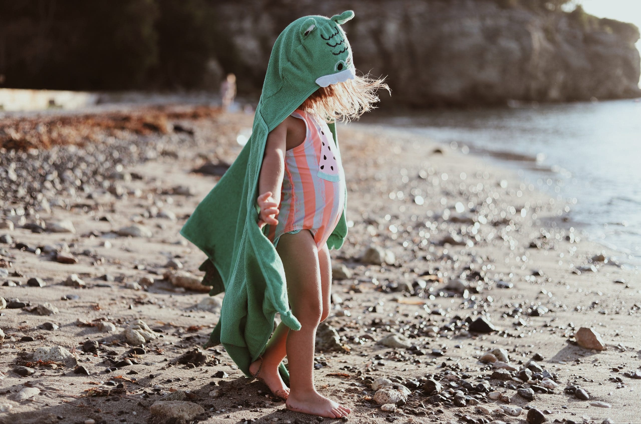 Child wearing a poncho towel