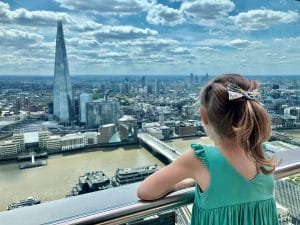 Europe with kids cover: little girl looking at London skyline