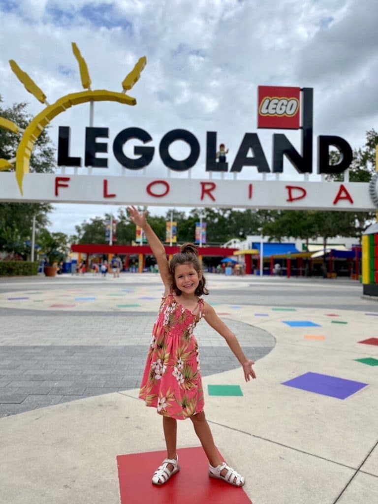 Little girl in front of Legoland Florida.