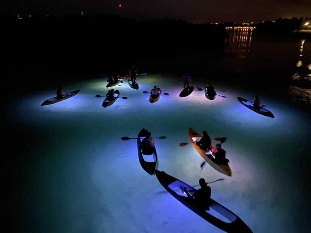 Glowing Kayak in the night on the water in Florida