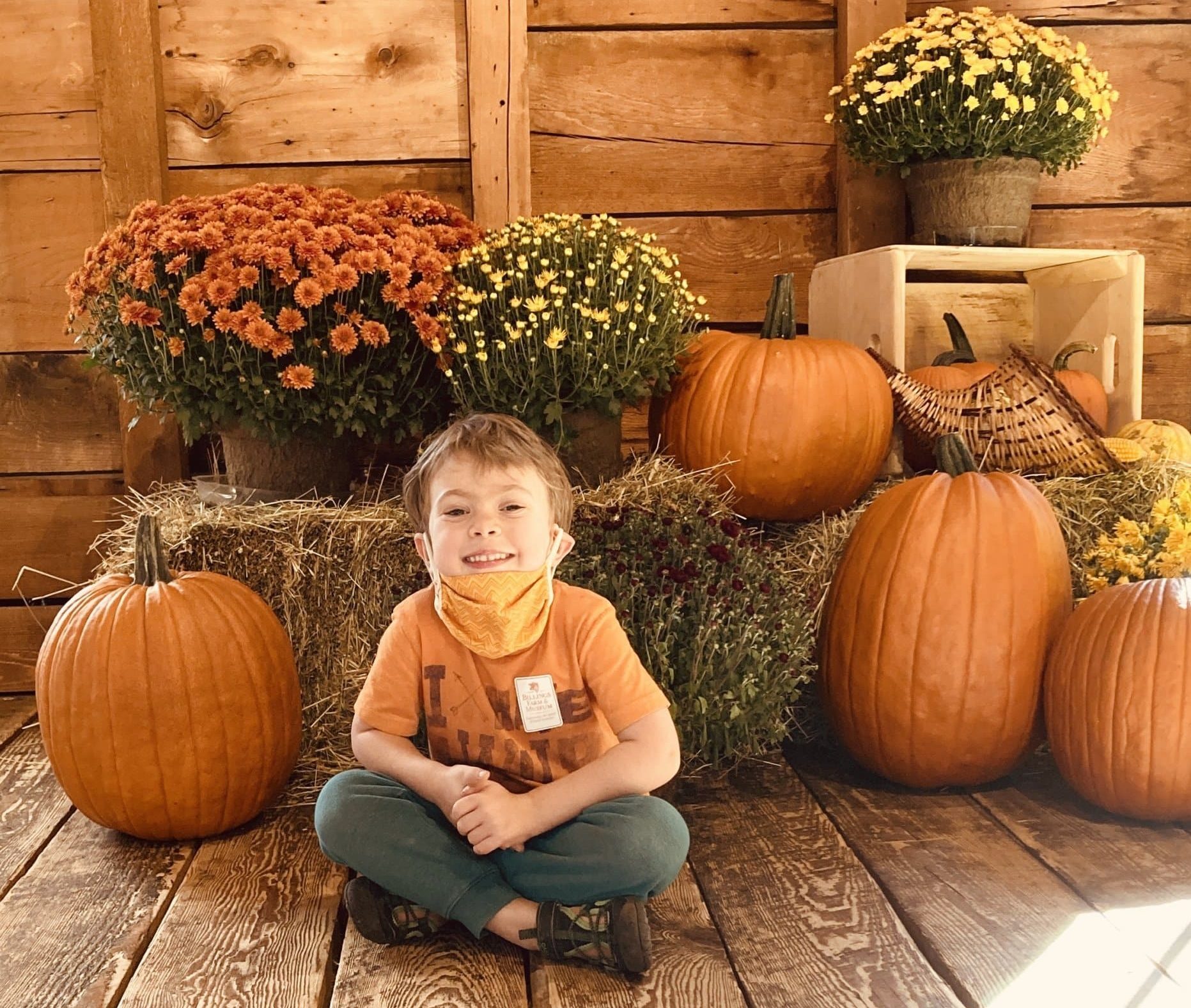 Little boy smiling in a US fall town