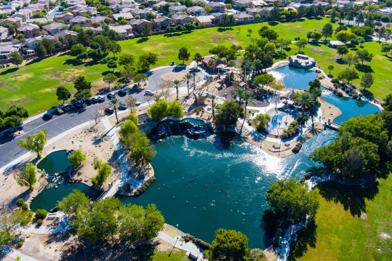 an aerial view of the pond in aliante nature discovery park with palm trees