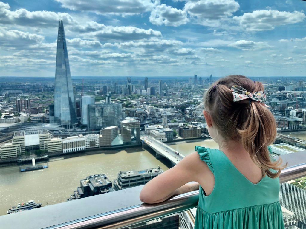 Little girl looking at London from above