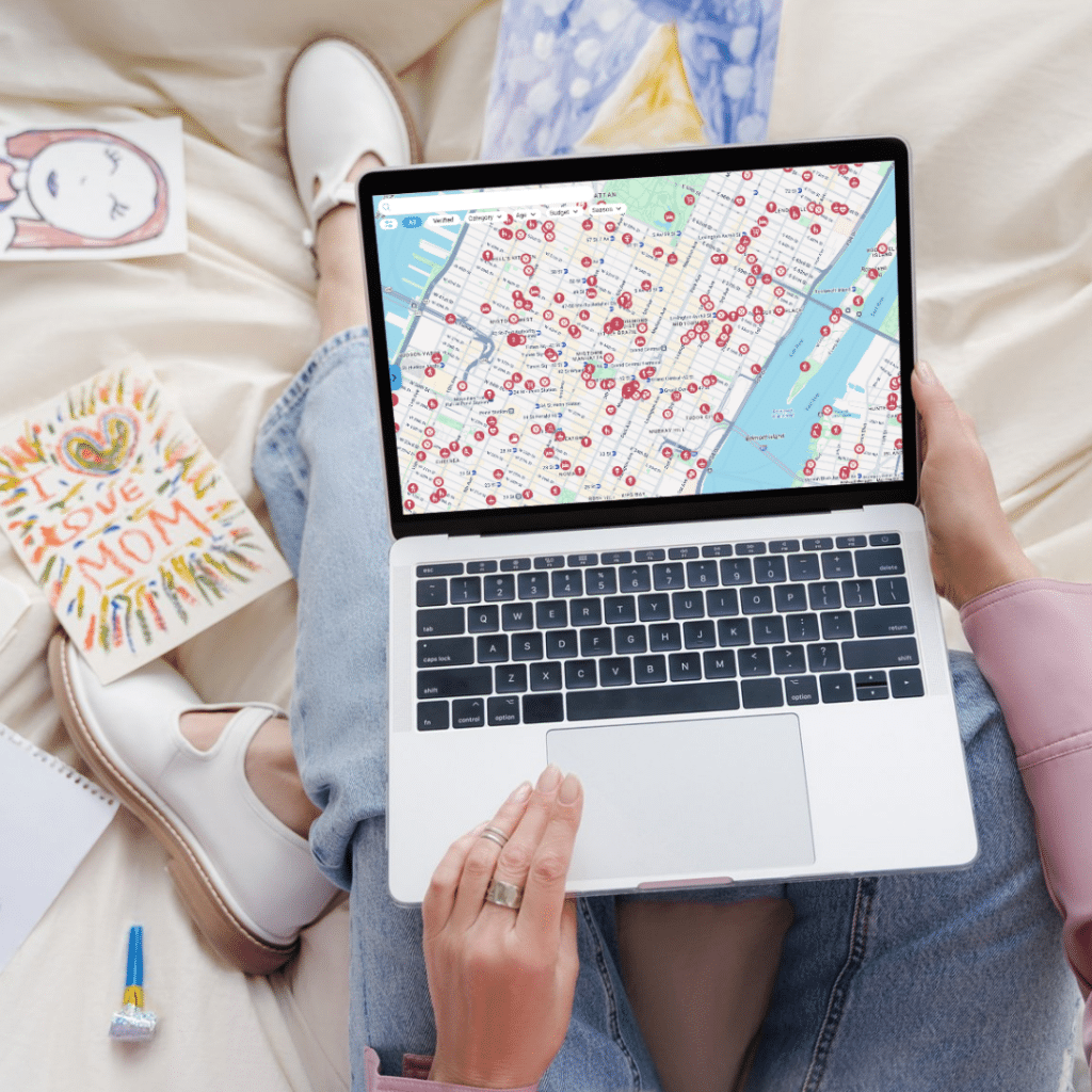 woman using gowhee app on laptop with tons of kid-friendly places