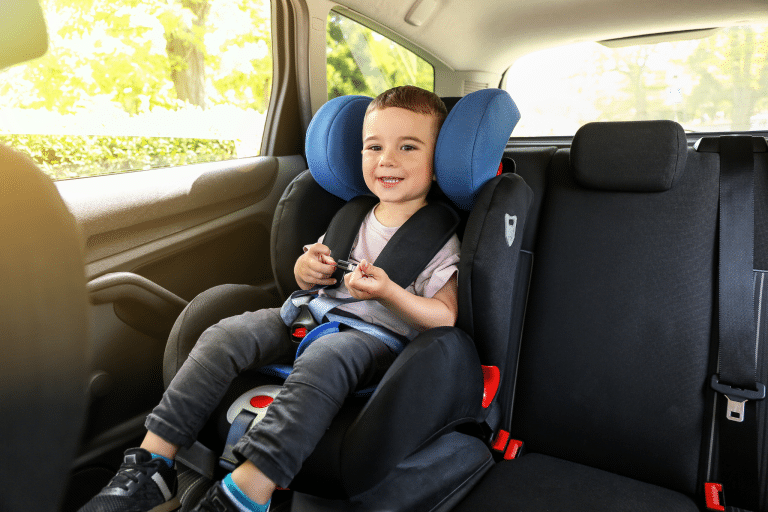 Child in car seat safely secured.